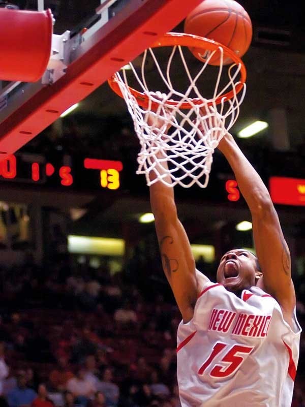 UNM guard J.R. Giddens dunks in a game against St. Bonaventure during Saturday's Basketball Travelers Invitational at The Pit. The Lobos swept the tournament Sunday.