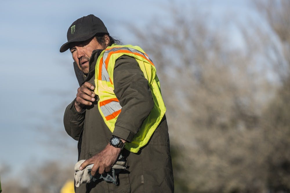 A homeless man works in Nob Hill as part of the citywide “There’s A Better Way” initiative that provides panhandlers with meals and some money for a day's work.