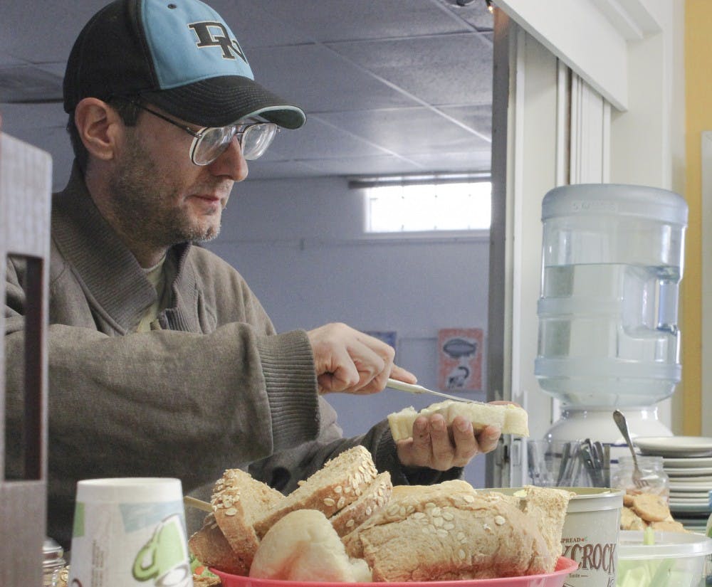 Rick Keeney grabs a free meal on Thursday at the Albuquerque Center for Peace and Justice. The center aims to provide individuals with resources for peace and justice projects as well as meeting needs for Albuquerques homeless population. 

