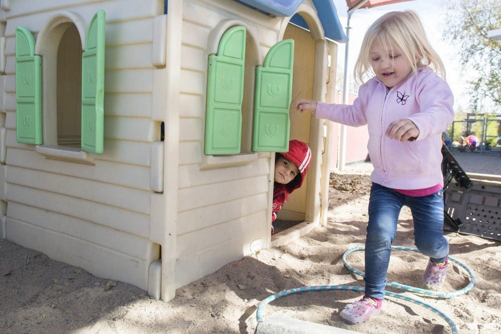 Ruby, right, and Emilio play house during their playtime at Cuidando Los Ninos, or CLNkids, on Nov. 19. CLNkids is a homeless child care and family resource center that has been working with homeless families in Albuquerque for 25 years.