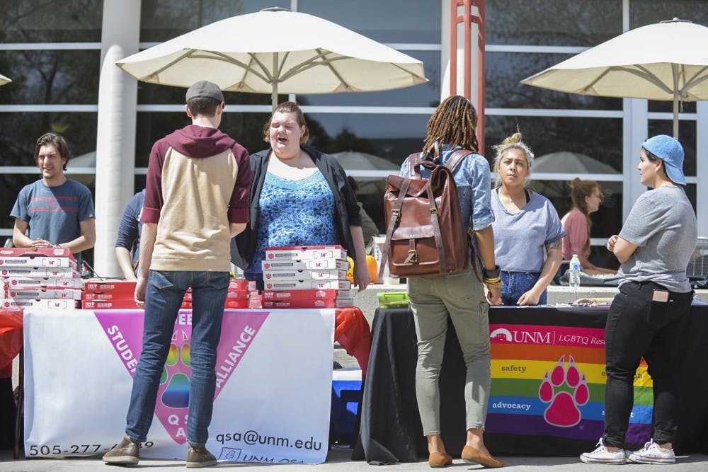 Passersby stop to talk to LGBTQ Resource Center staff on Friday, April 7, 2017 during an event held in conjunction with Sexual Assault Awareness Month. 