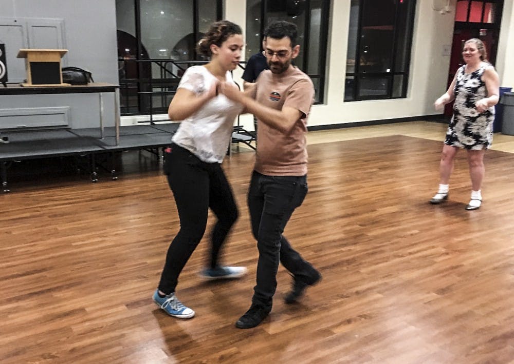 People swing dance at the Cellar in&nbsp;Hokona Hall.Photo courtesy of Aubrie Powell