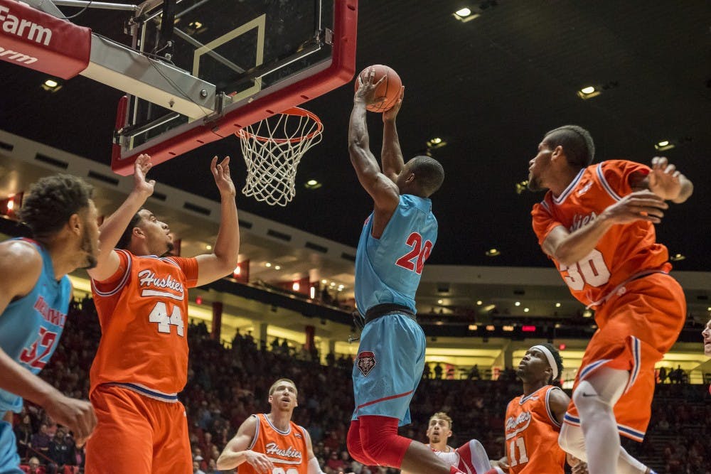 UNM Guard Sam Longwood dunks the ball through the Hoston Baptist defense on Monday November 14, 2016 at WisePies Arena.