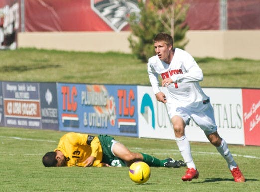 Justin Davis kicks the ball downfield against Sacramento State on Sunday at the UNM Soccer Complex. Davis added a goal in the Lobos' 2-1 victory. 