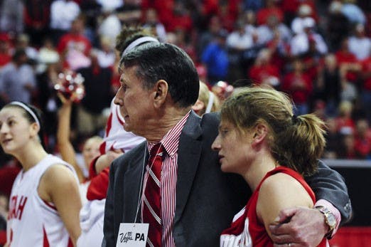 Head coach Don Flanagan takes Amy Beggin under his wing after the Lobos were defeated 56-55 in the semifinals of the Mountain West Conference Tournament on Friday. Beggin had an opportunity to put the Lobos up by three late in the game, but she missed two