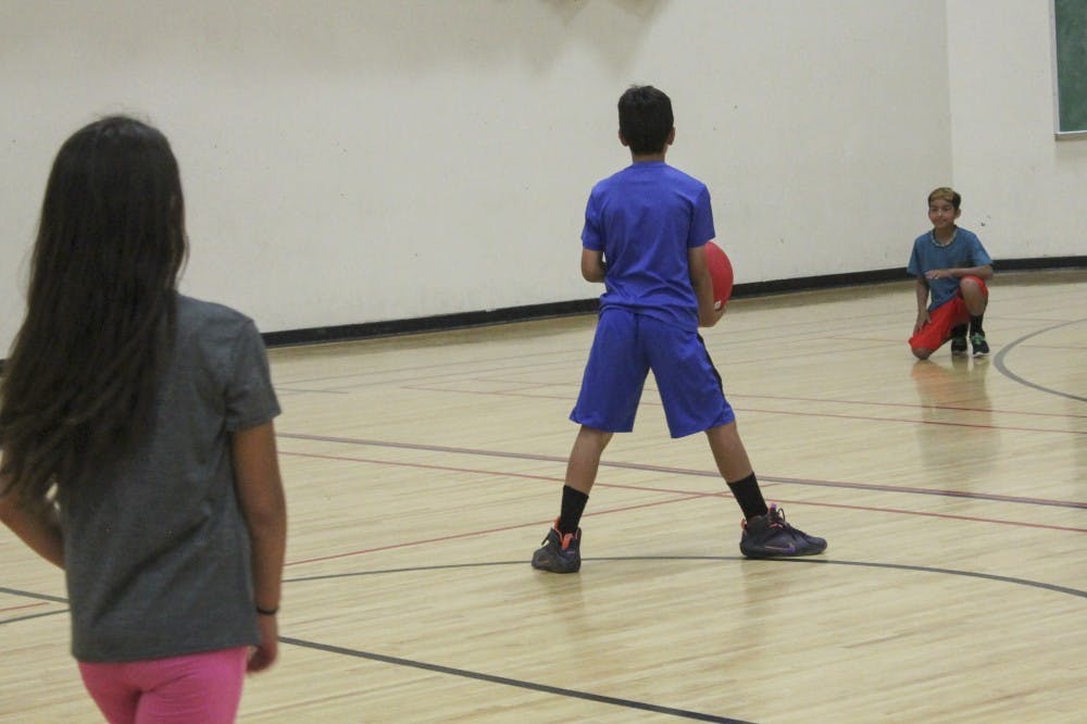 Kids playing a game at RAD Camp. The summer camp is a recreation service through Johnson Center.