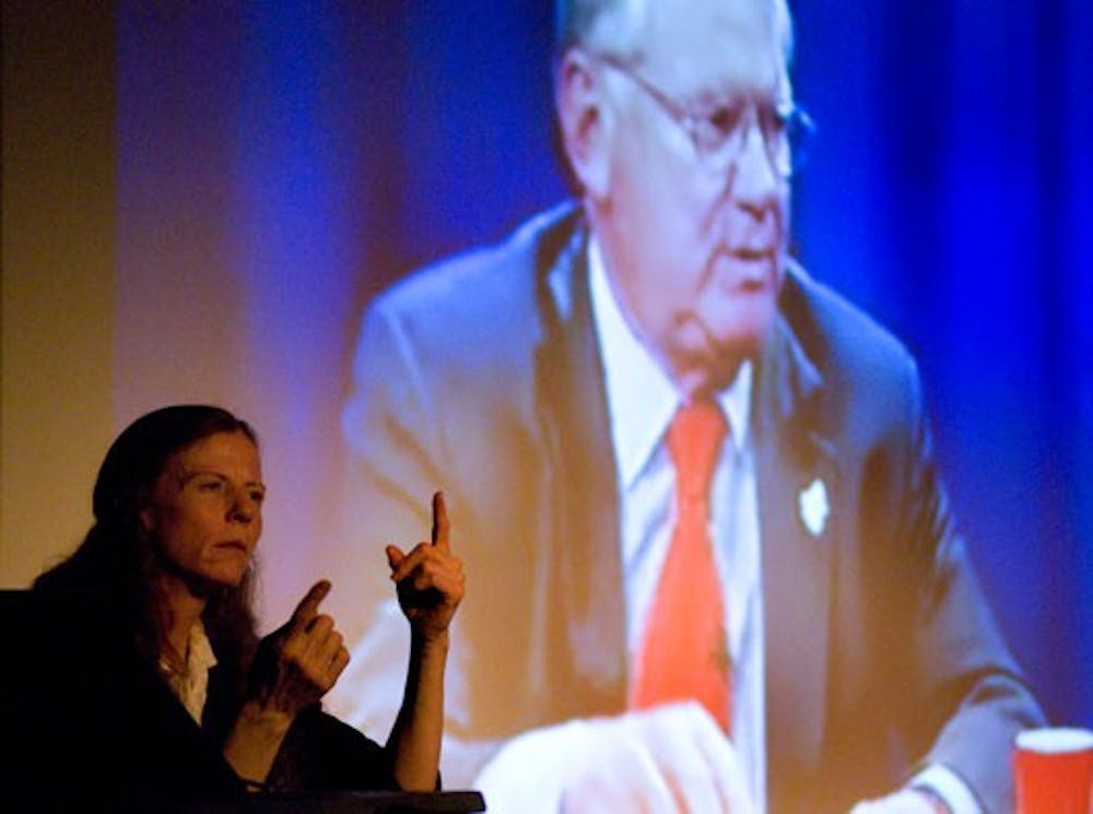 Helen Arenholz of Accessibility Services signs President David Schmidly's Web cast on Tuesday at the SUB Theater. Students, faculty and staff logged on and listened to Schmidly outline his goals for the future of UNM.