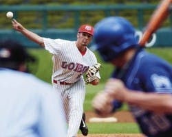 Senior pitcher Nate Melek throws to Air Force's Price Paramore during the Lobos' 23-11 win at Isotopes Park on Thursday.