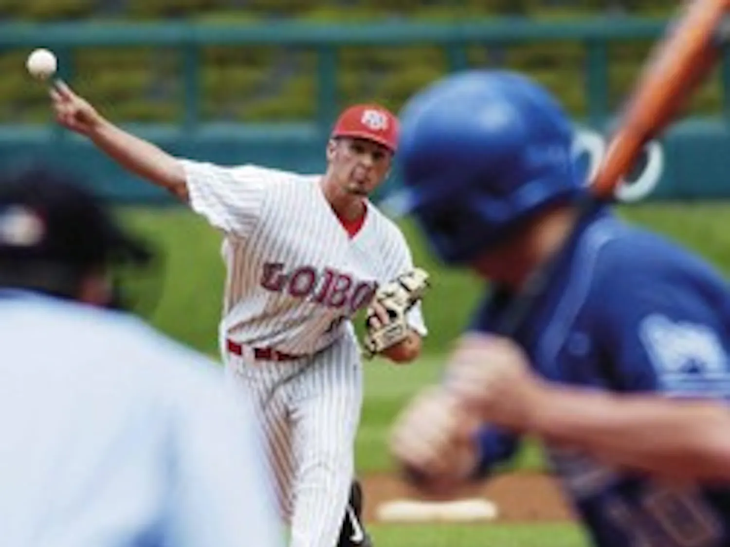 Senior pitcher Nate Melek throws to Air Force's Price Paramore during the Lobos' 23-11 win at Isotopes Park on Thursday.