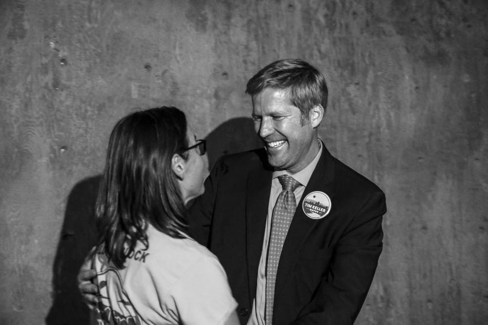 Tim Keller, right, embraces his wife, Liz Kistin Keller on Oct. 03, 2017 during the mayoral watch party at Red Door Brewing Company. 