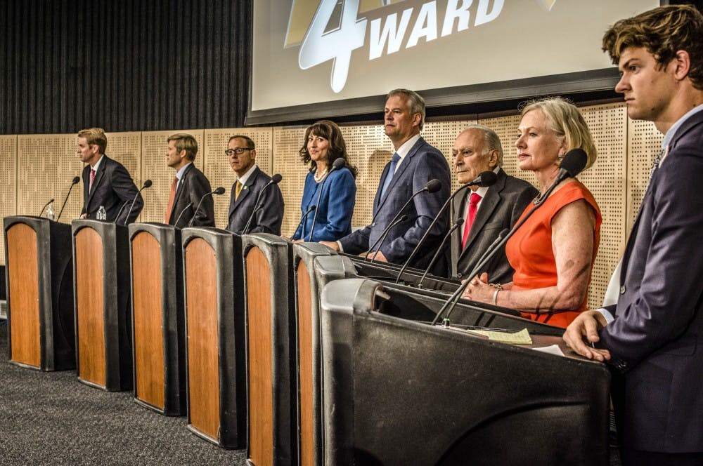 Mayoral candidates, Gus Pedrotty right, Susan Wheeler-Deichsel, Ricardo Chaves, Wayne Johnson, Michelle Garcia Holmes, Brian Col?n, Tim Keller and Dan Lewis debate at Smith Brasher Hall on CNM?s main campus during the KOB Channel 4 Mayoral Debate on Friday, Sept. 15, 2017.