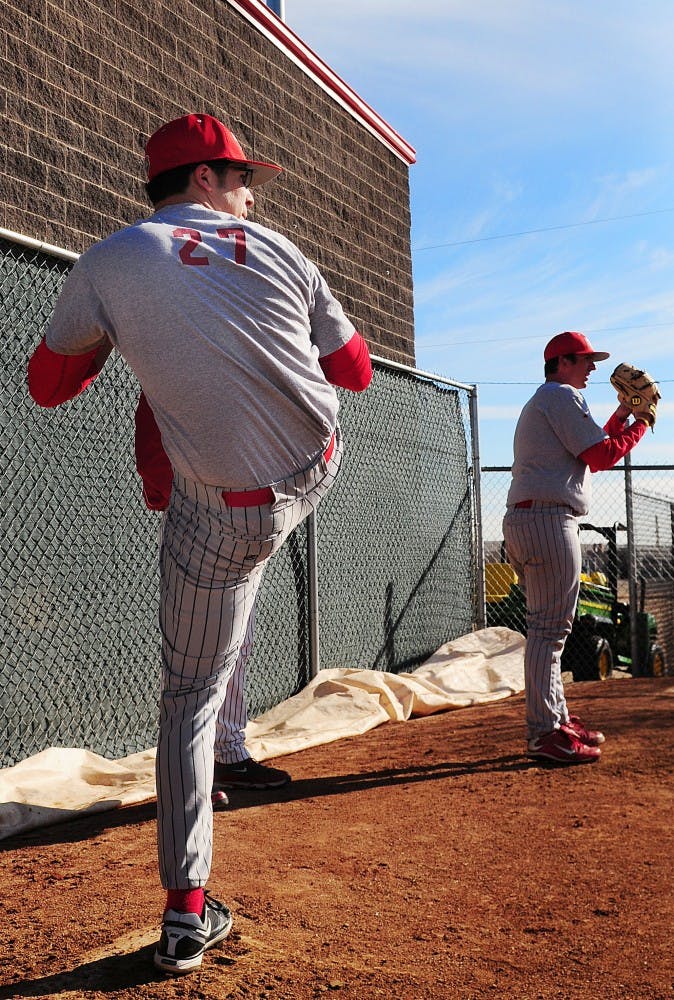 	Rudy Jaramillo prepares to unload a baseball atop the mound on Tuesday at Lobo Field. UNM will rely heavily on its pitchers this season.