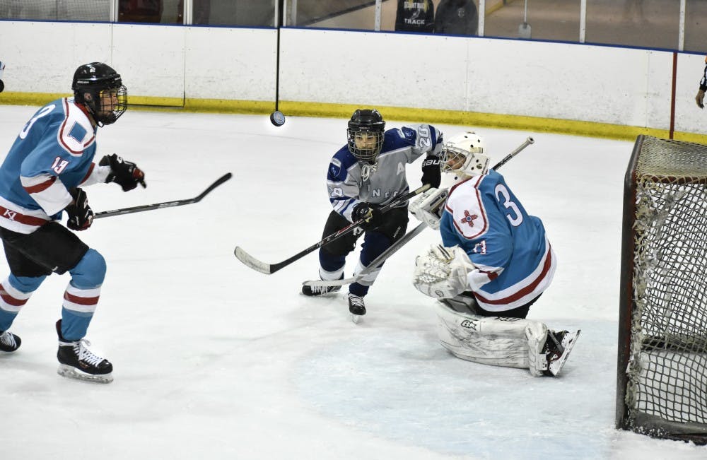 A Colorado School of Mines hockey player tries to score against the University of New Mexico on Saturday, Sept. 15.