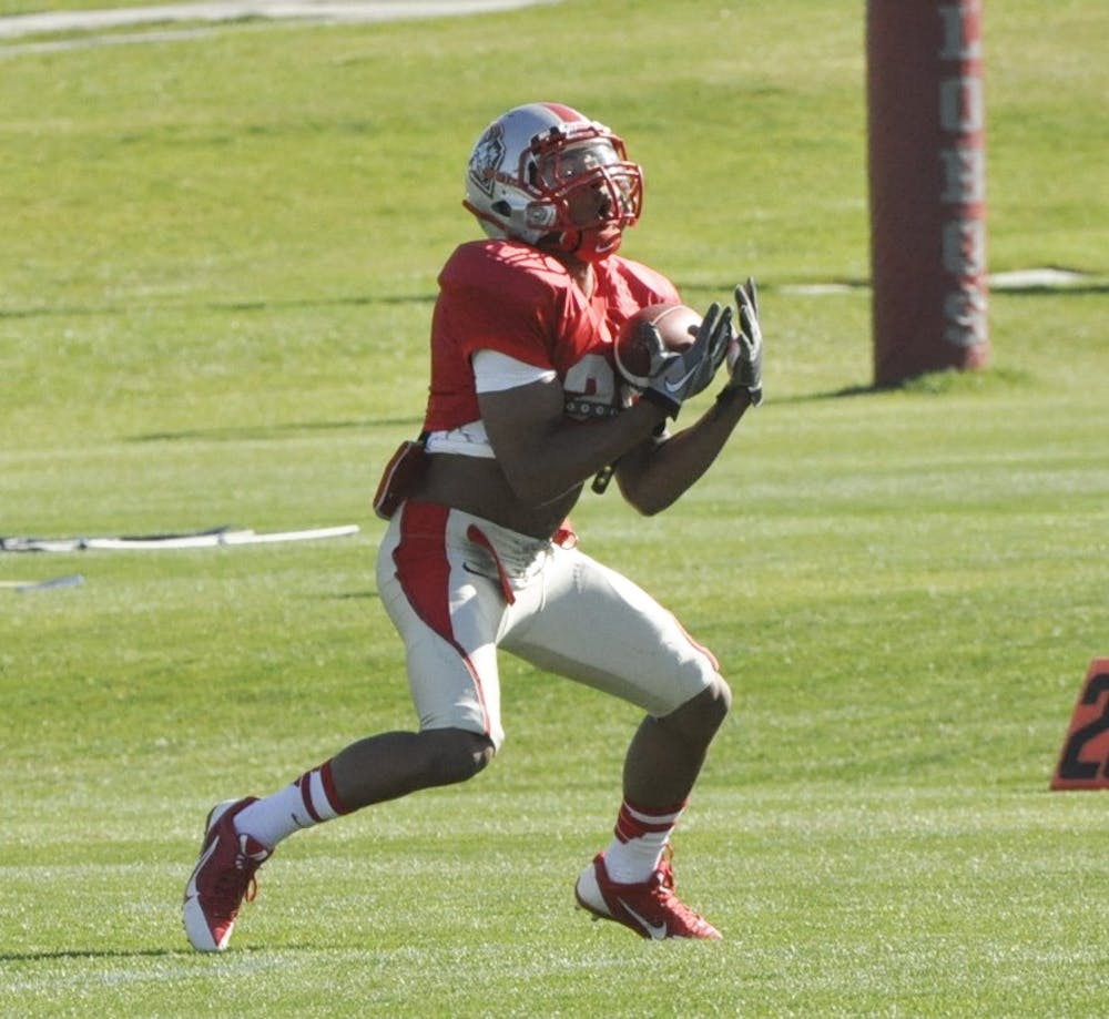 Senior wide receiver Carlos Wiggins catches the ball during the Lobos spring practice at Tow Diehm Complex on Wednesday morning. 
