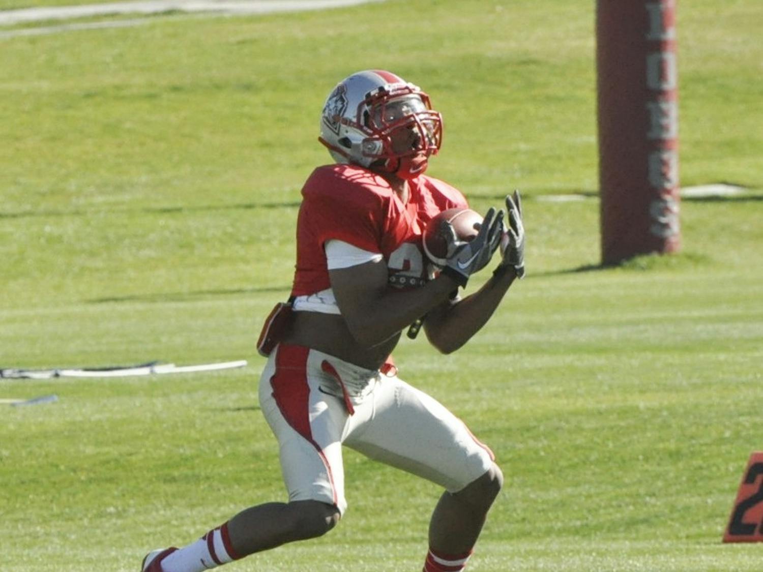 Senior wide receiver Carlos Wiggins catches the ball during the Lobos spring practice at Tow Diehm Complex on Wednesday morning. 