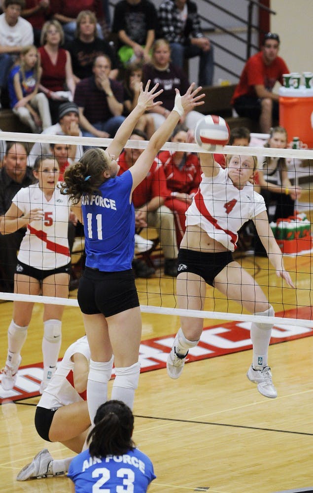 	Ashley Rhoades spikes the ball over the net Saturday at Johnson Gym. The Lobos defeated Air Force, 3-0.