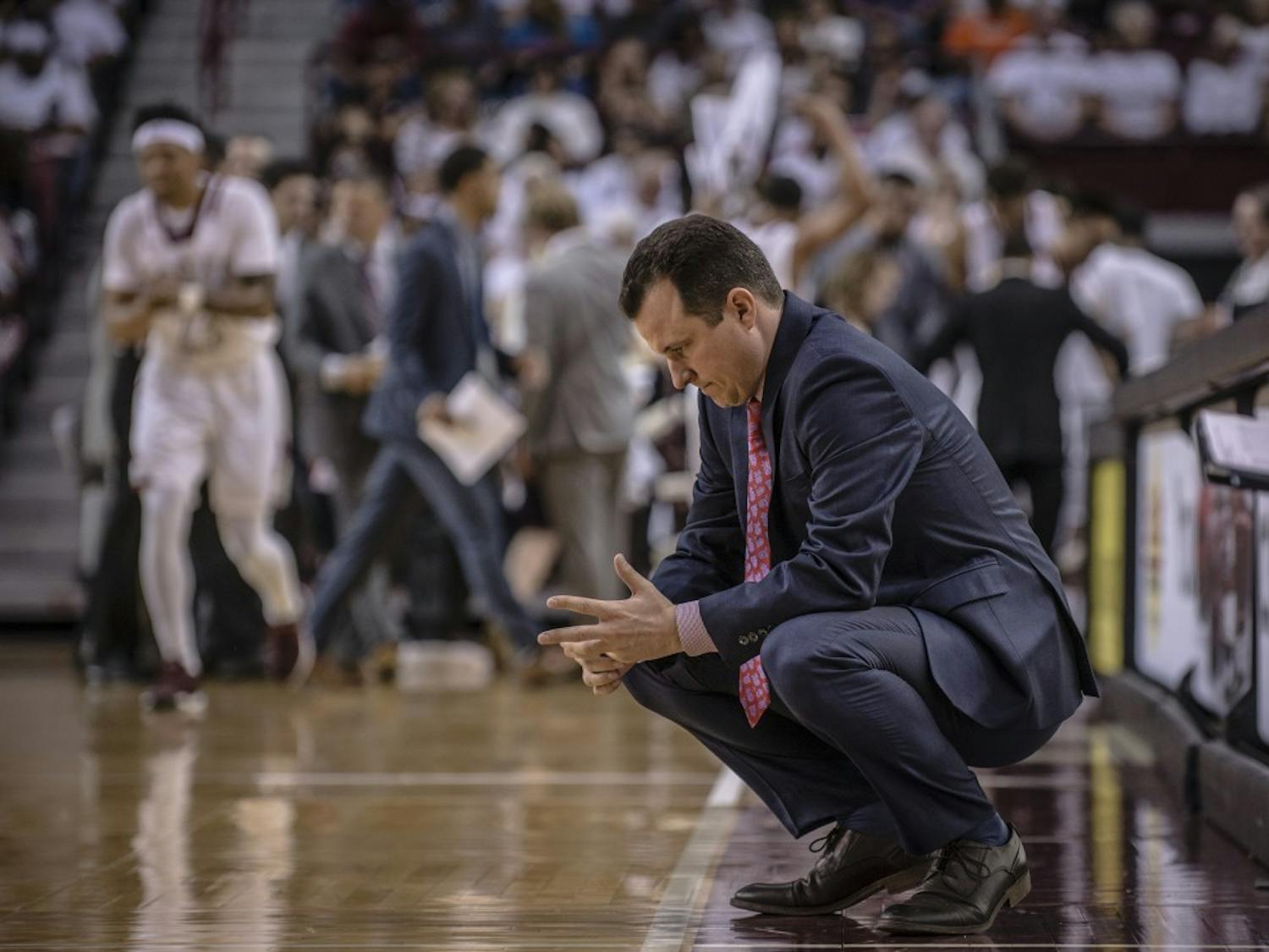 UNM&nbsp;Men's basketball coach Paul Weir sits on the sidelines on Nov. 17, 2017 in the Aggies hometown of Las Cruces.
