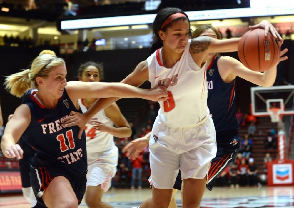 Sophomore guard Cherise&nbsp;Beynon fights for the ball against a Fresno State player at WisePies Arena Saturday night. The Lobos play Utah State Saturday in Logan, Utah.