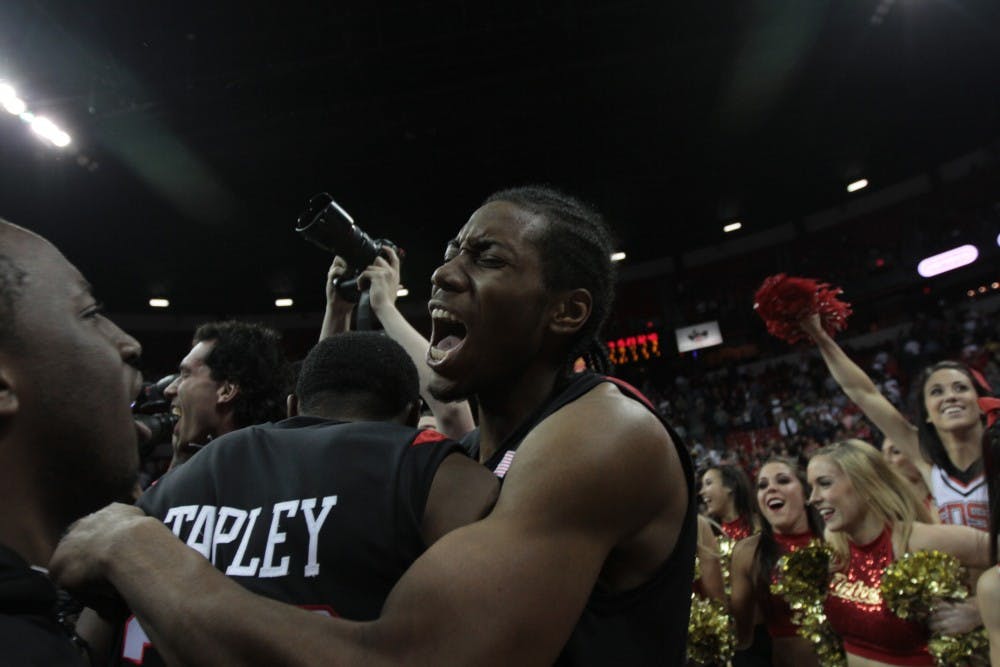 	Aztecs&#8217; point guard, D.J. Gay, center, and Brian Carlwell, left, huddle at the conclusion of Saturday&#8217;s MWC tournament final. The
Aztecs earned an automatic bid to the NCAA Tournament by defeating UNLV.