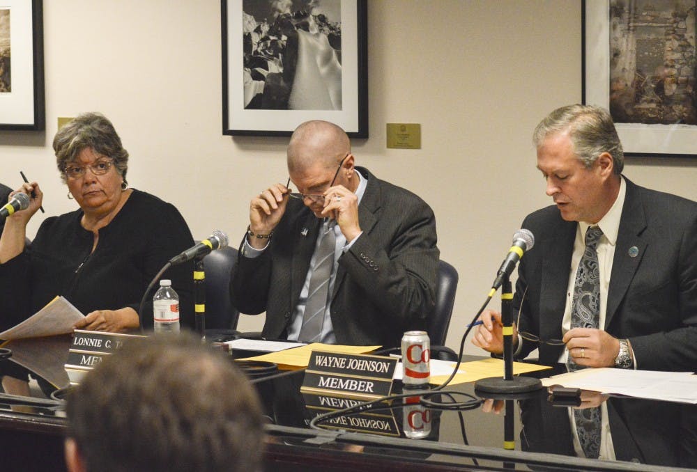 	Bernalillo County Commission Chairwoman Debbie O’Malley, left, listens to Wayne Johnson, right, as he speaks about letting voters decide on decriminalizing an ounce or less of marijuana during a Commission meeting at City Hall on Monday morning. The Commission agreed to attach the question to the November ballot.