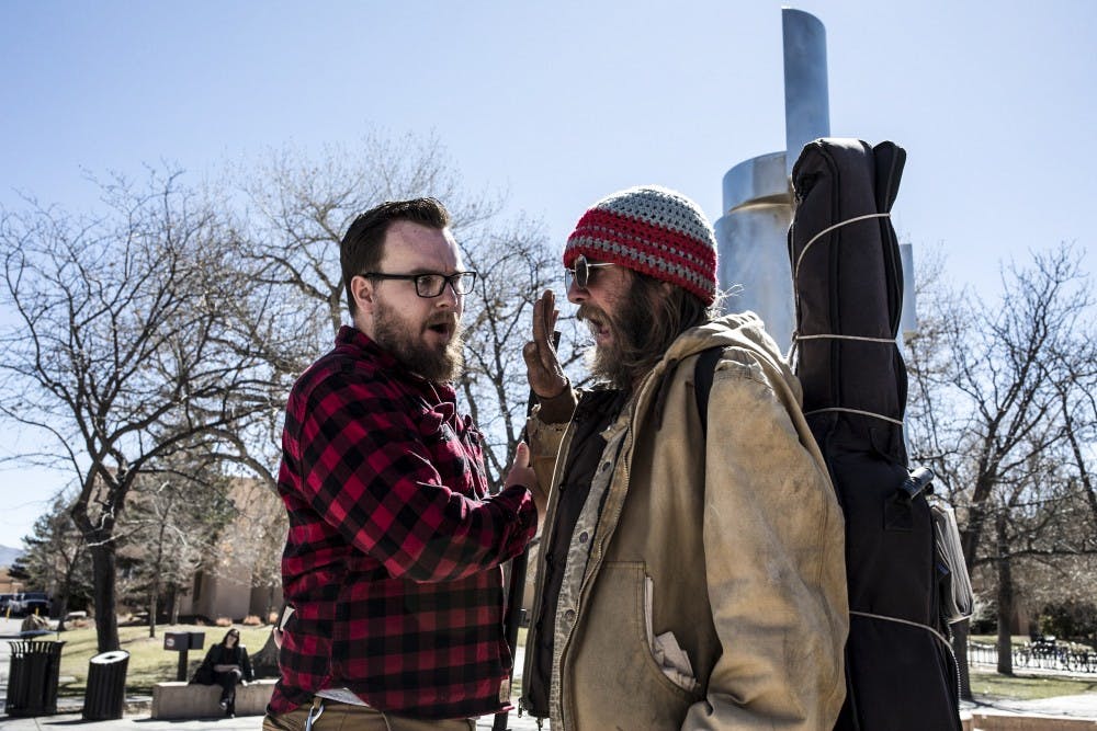 After making religious statements,&nbsp;Sebastian Bryan (left) of&nbsp;In Christ Is Life&nbsp;debates hotly with Karo Johnson.
