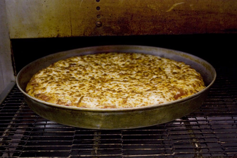 	A pizza just out of the oven. Pizza 9 specializes in Chicago-style pies.