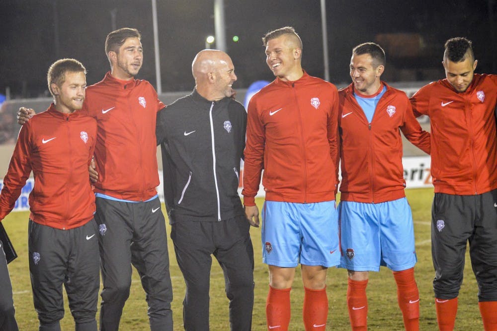 UNM Head Soccer Coach Jeremy Fishbein laughs with five of his senior players that will be leaving after this fall 2016 season.