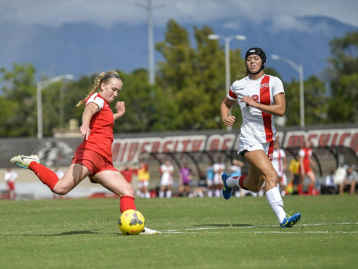 Forward Quincy Slora passes the ball down field while evaiding a UNLV player during their game Sunday Oct. 4, 2015. The Lobos lost 1-3 and will play San Jose Oct. 16.