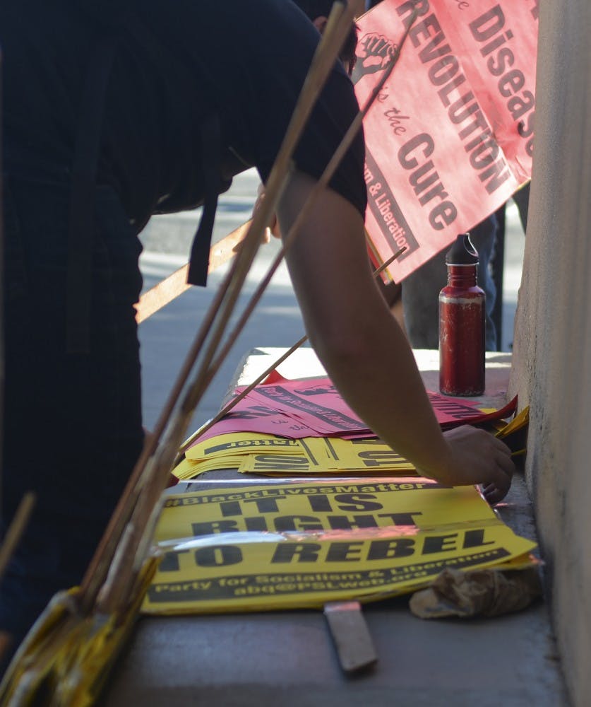A protester put together the protest signs on Wednesday afternoon as part of the Black Lives Matter movement. Party of the Socialism and Liberation organized the rally.