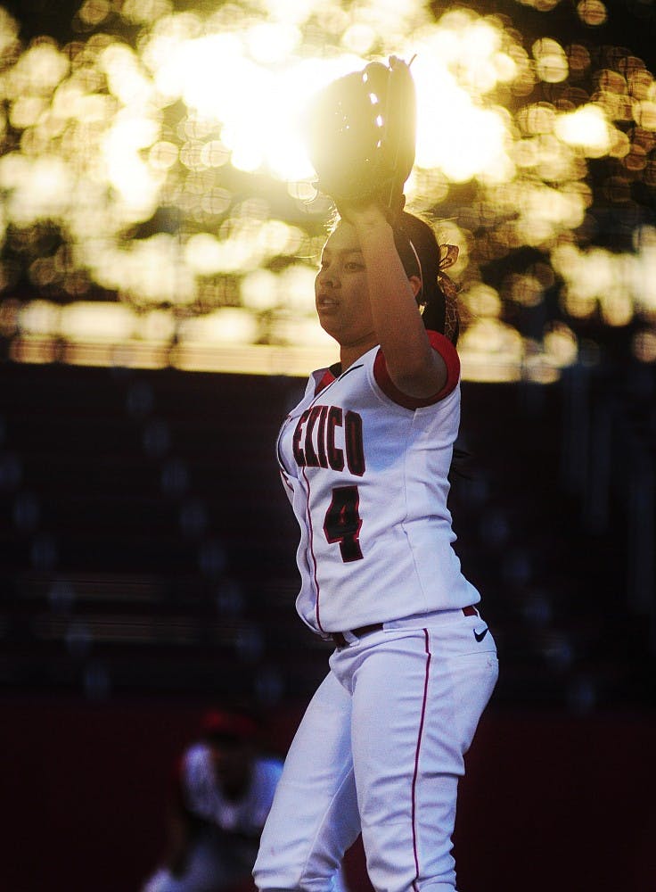 	Lobo pitcher Kari Gutierrez puts her glove up and calls for the ball back from the catcher during UNM’s 12-3 loss to NMSU on Tuesday at the UNM Softball Complex.