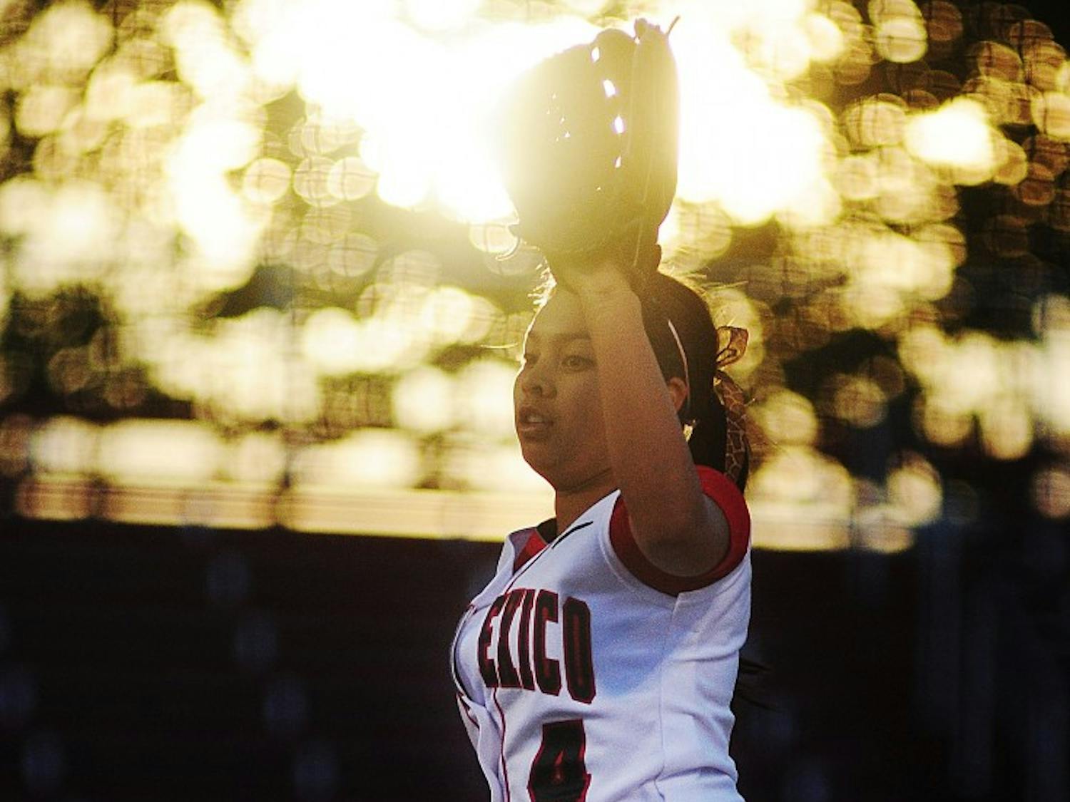 Lobo pitcher Kari Gutierrez puts her glove up and calls for the ball back from the catcher during UNM’s 12-3 loss to NMSU on Tuesday at the UNM Softball Complex.