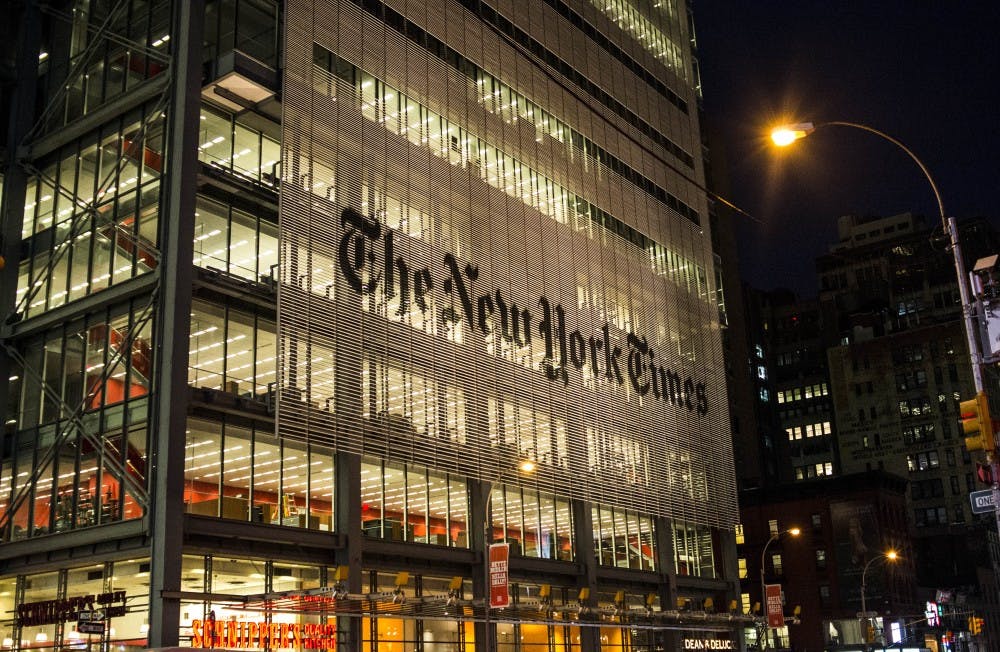 The New York Times Building stands illuminated in Midtown Manhattan on August 3, 2017. The Times Building is the seventh tallest building in New York City and hosts some of the nation's most acclaimed journalists. 

