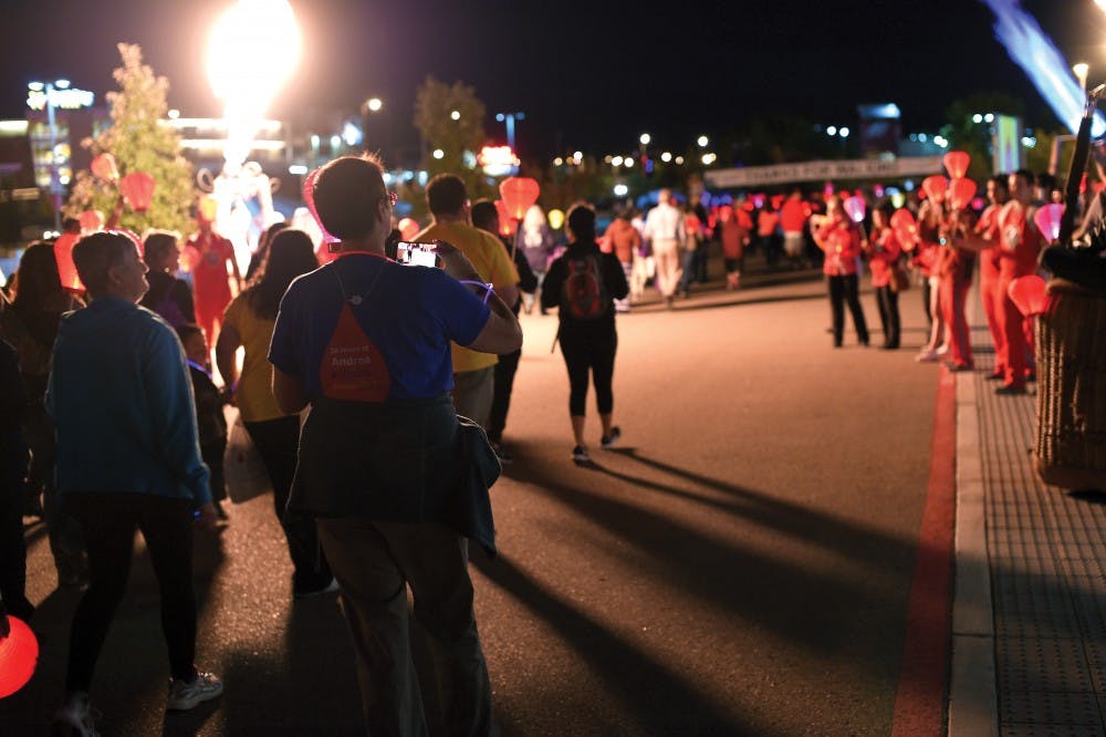 Light the Night participants cross the finish line at the WisePies arena on Sunday, Oct. 25. Light the Night is an annual benefit and walk to support reaserch for Leukemia and Lymphoma.