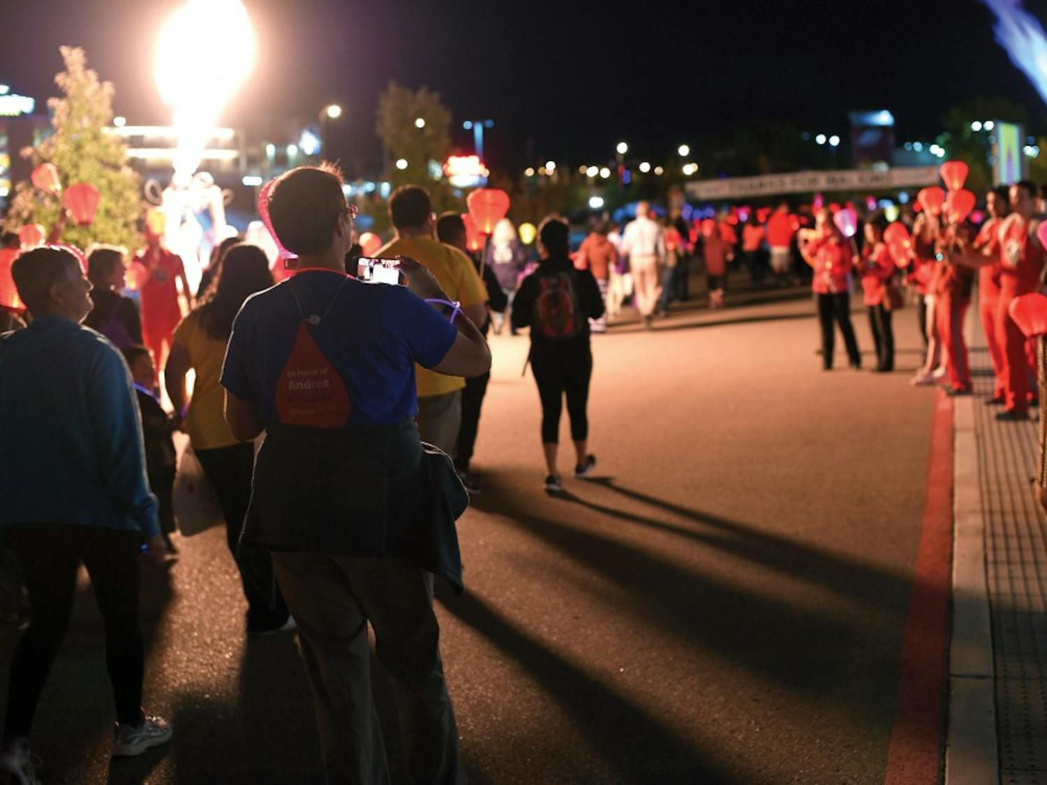 Light the Night participants cross the finish line at the WisePies arena on Sunday, Oct. 25. Light the Night is an annual benefit and walk to support reaserch for Leukemia and Lymphoma.