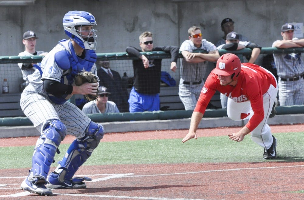 Carl Stajduhar slides into home plate during an April 11 game against Air Force. Despite struggling with injuries and close losses, the Lobos game within one game of winning the Mountain West Championship.