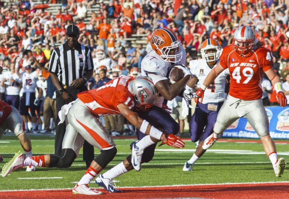 UTEP's Aaron Jones #29 runs in the first touchdown as he gets past the New Mexico defense. The Lobos faced the UTEP Miners for the first game of the season Saturday evening at University Stadium. UTEP defeated New Mexico 31-24.