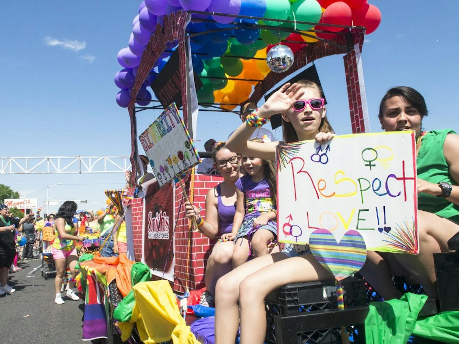 Participants wave at parade goers at the Gay Pride Festival in 2014. This years Pride Parade will take place on June 13.