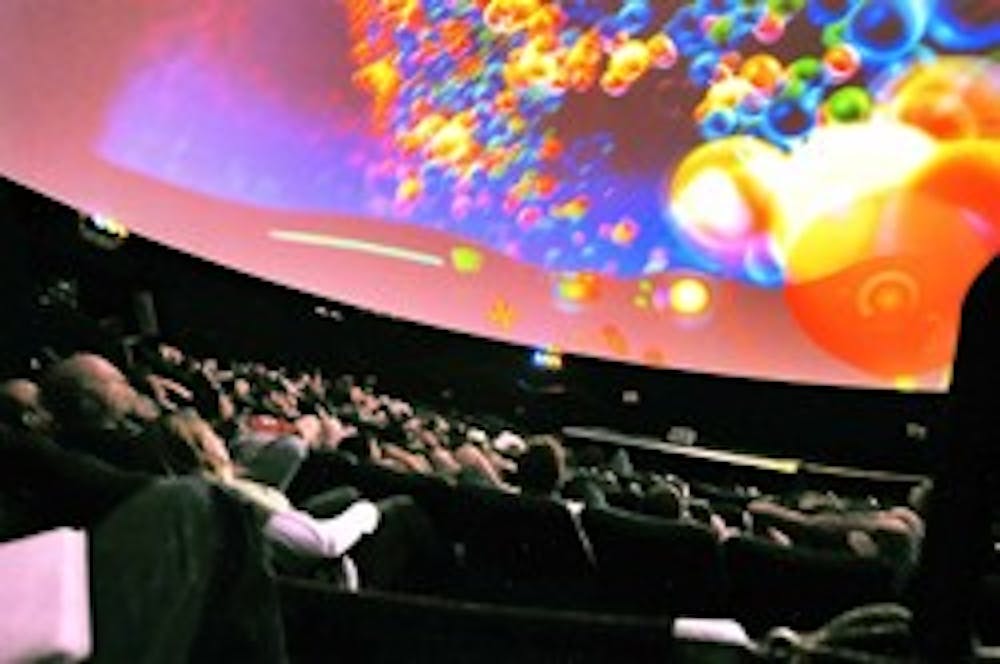 Students and teachers from Seven Bar Elementary School watch "Molecularium" at the LodeStar Theater on Thursday.