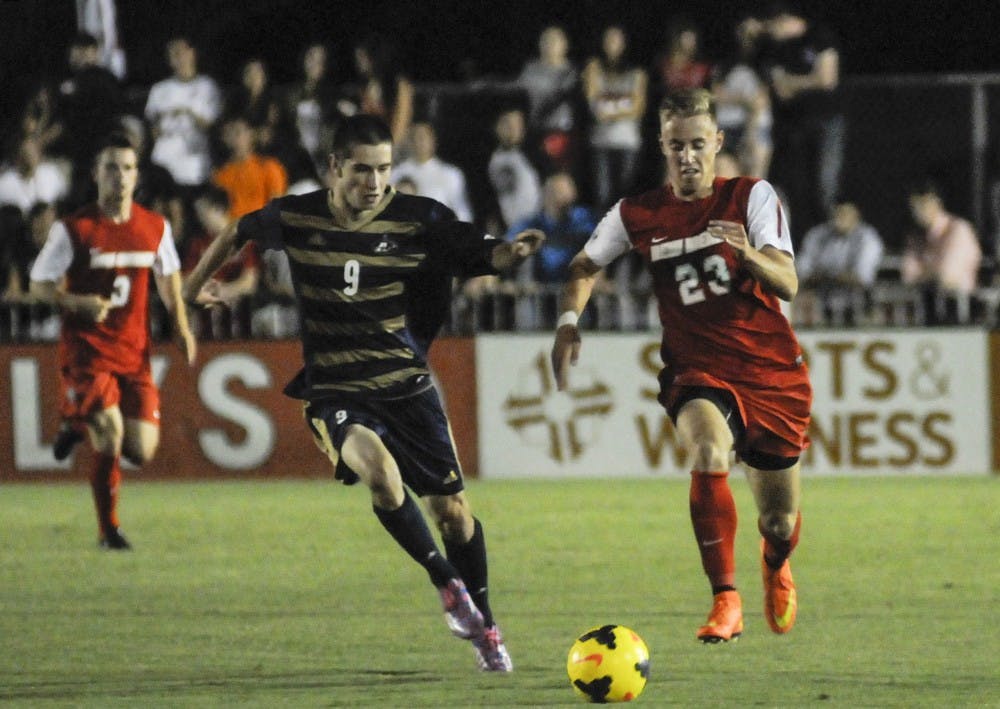 	New Mexico forward Sam Gleadle chases the ball down from Akron’s Stuart Holthusen during their game Aug. 29 at the UNM Soccer Complex.. The Lobos play UC Riverside at 7 p.m. today and against No.1 UCLA at 6 p.m. Sunday.