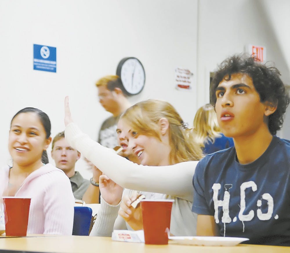 Student Stacey Peters, center, celebrates with Marissa Nu