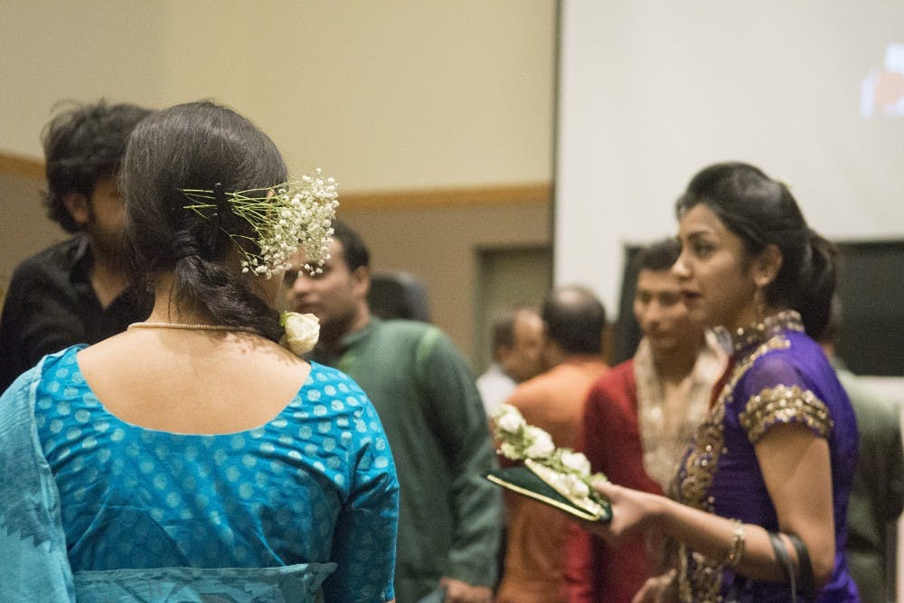 People gather on Saturday night at the SUB ballrooms to celebrate International Mother Language Day. The event, hosted by Bangladesh Student Association of UNM, brought individuals together to celebrate Indian culture complete with native dress and dance. 