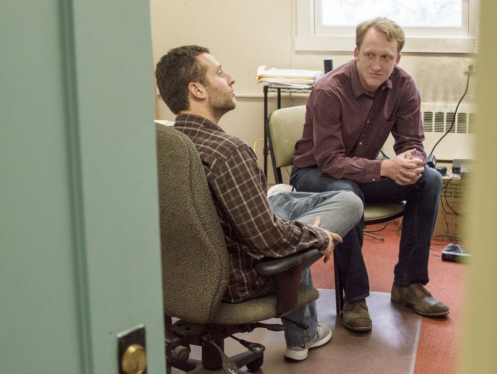 	Dr. Jonathan Stieglitz, left, a member of the Tsimane Health and Life History Project’s team, and graduate student Daniel Cummings talk about the work UNM’s team is doing to help those affected by the recent flooding in Bolivia. They met on Tuesday in Bandelier Hall.