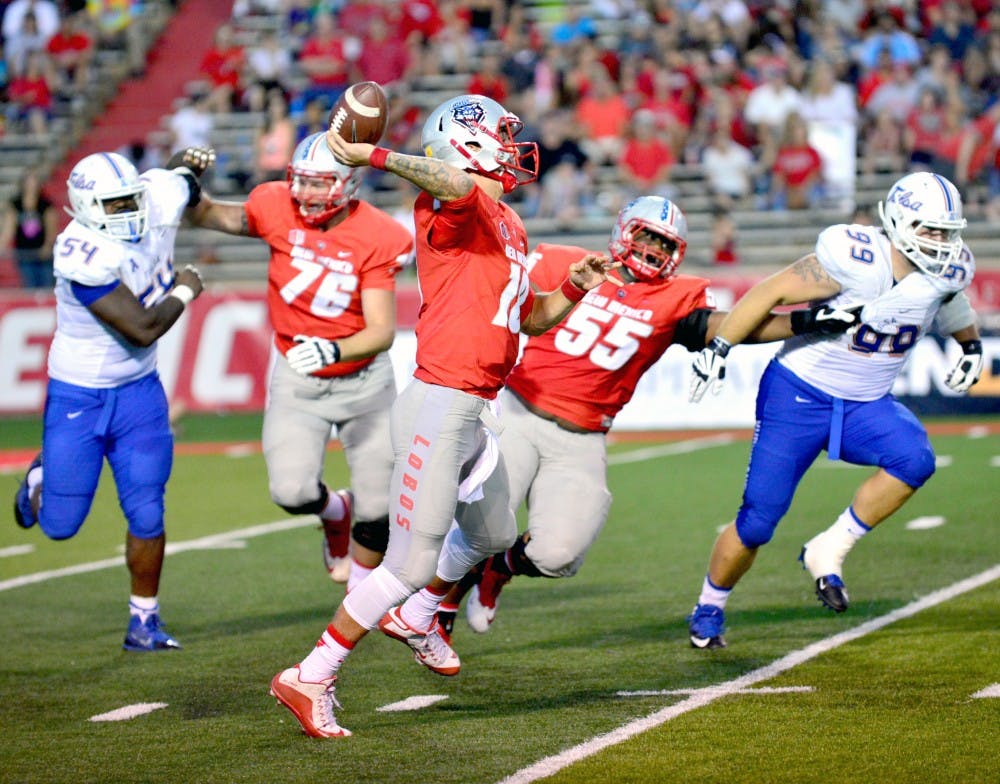 Lobo quarterback Austin Apodaca prepares to pass as he is chased down by Tulsa’s defensive line. The Lobos play the Sun Devils this Friday in Tempe, Arizona.