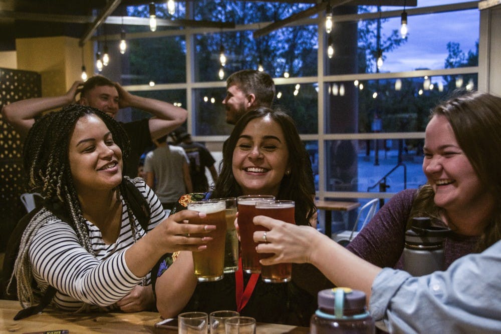 Students and staff celebrate the grand opening of the new university taproom in the SUB October 1, 2018.