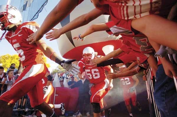 Fans cheer on the Lobos as they take the field before the second half of Saturday's game against Colorado State. UNM won 26-23.