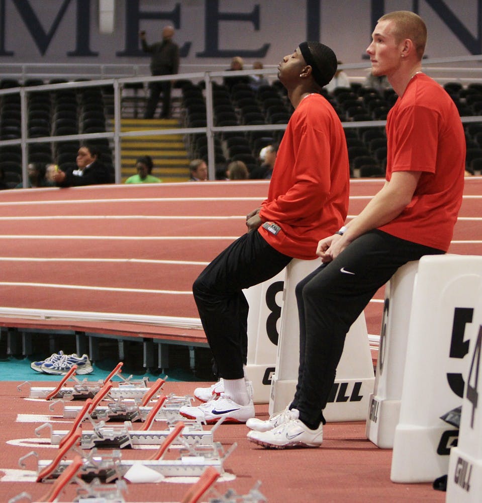 	Freshman Ty Kirk, left, and teammate, Zach Smith, prepare for the preliminary round of the men’s 60-meter dash on Saturday
