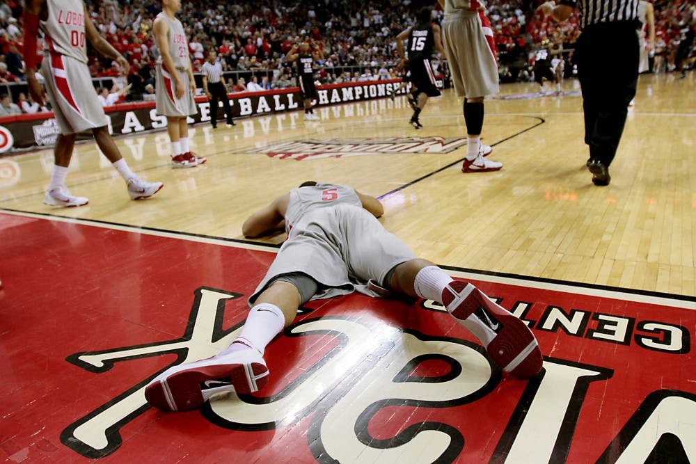 	Dairese Gary lays sprawled out on the hardwood at the Thomas &amp; Mack Center on Friday, after missing a potential tying shot with second remaining in the game. UNM was defeated, 72-69 at the hands of San Diego State.