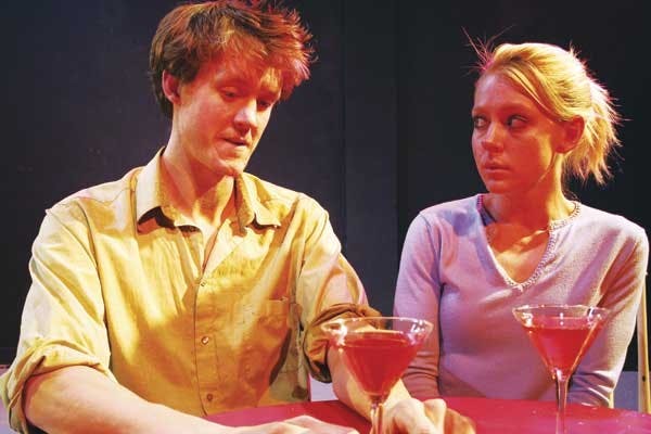 Tony (Blake Catherwood) and Theresa (Jaclyn Jardine) talk over cocktails in "Boy Gets Girl."