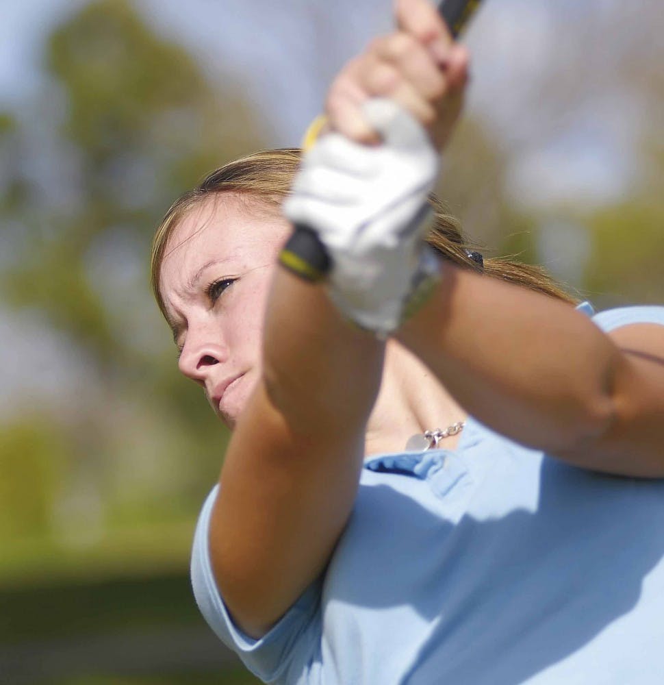 Golfer Jodi Ewart practices at the driving range of UNM's Championship Golf Course on Thursday.
