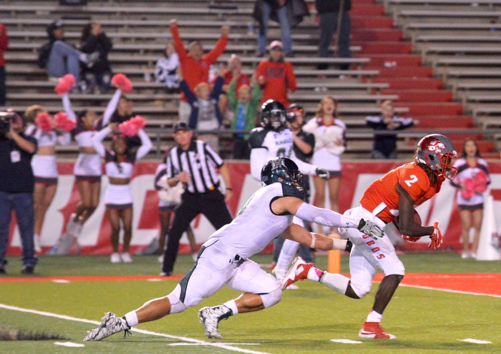 Junior wide receiver Dameon Gamblin breaks free from a Hawaii players hold at University Stadium Oct. 17. The Lobos play Utah State this Saturday at 1:30 p.m..